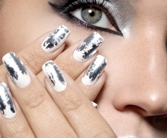 Beautiful girl with the silver makeup and  metal nails. Fashion woman portrait.